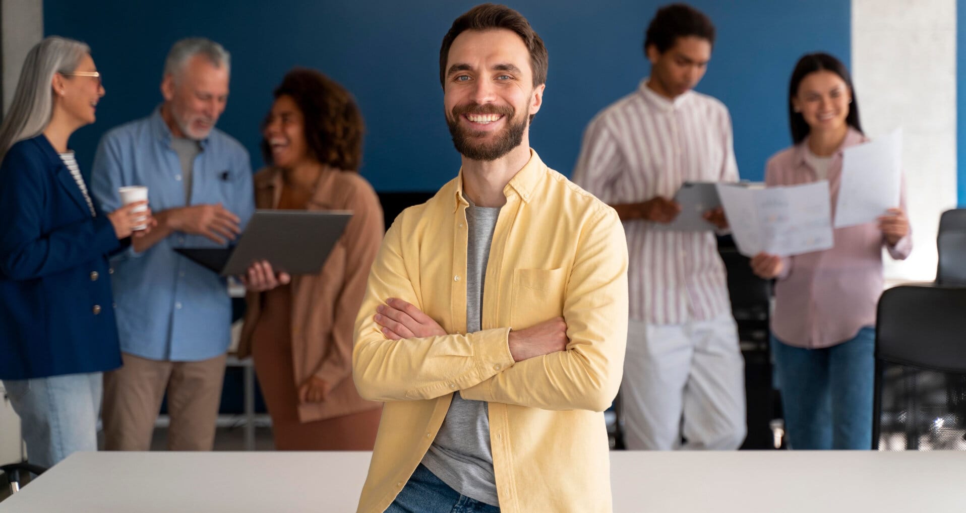 A man standing with a group of people in the background