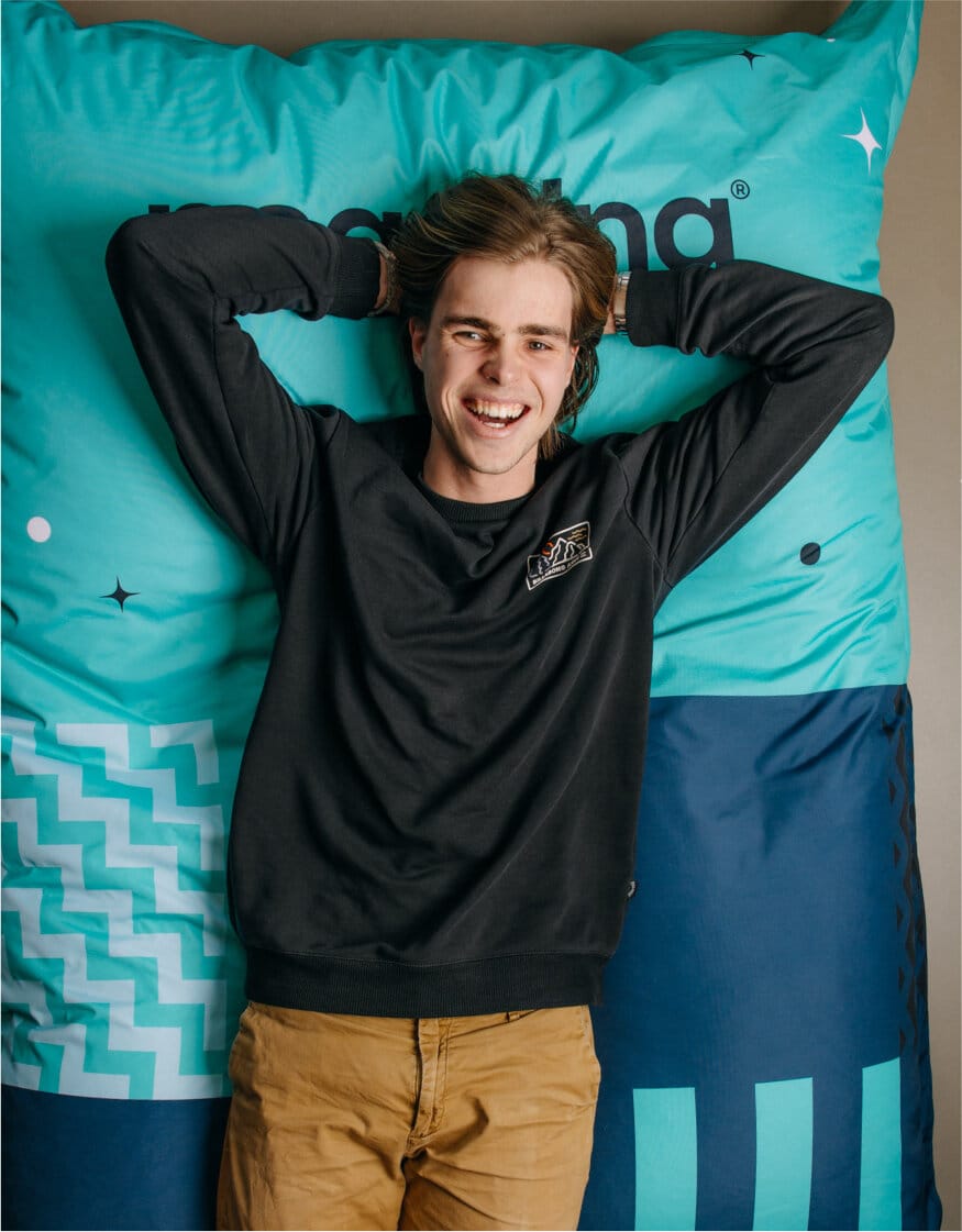 A person laying down on a mattress